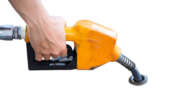 Gas pump held by hand with nozzle, alongside drill, tools, and worker in construction setting