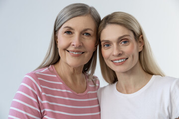 Two smiling pretty ladies looking happy and contented