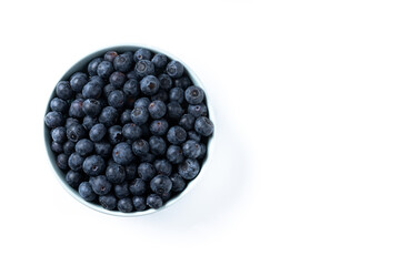 Blueberries in green bowl isolated on white background. Top view. Copy space