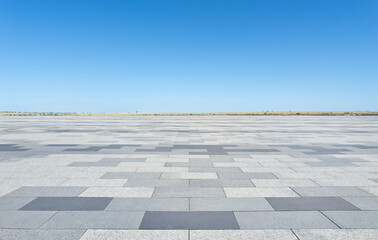 Empty concrete floor with blue sky