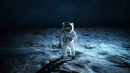 Lonely astronaut walks on the lunar surface. Lunar mission and exploration. Space man on the moon