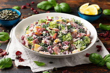 Healthy Homemade Broccoli Salad with bacon, red onion, cranberries, pumpkin seeds and cheese