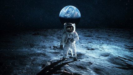 Astronaut walks on the surface of the moon overlooking the blue planet Earth. Lunar mission and...