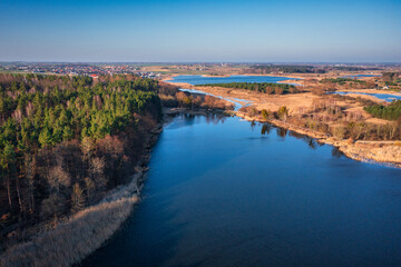 Beautiful aerial landscape of the lakes and forests of Kociewie in northern Poland at spring.