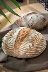 Artisan loaf of traditional homemade sourdough Boule bread . Selective focus.