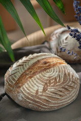 Artisan loaf of traditional homemade sourdough Boule bread . Selective focus.