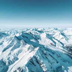 Alpine Majesty: Drone-Captured Panoramic View of Snow-Covered Peaks Under a Clear Blue Sky in the Serene Alps.