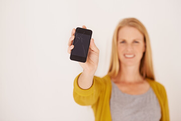 Woman, hand and blank phone screen in studio portrait with smile for mock up space by white background. Person, smartphone and happy for ux, mobile application and show for communication on network