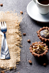 Chocolate baskets with nut cream. Homemade tartlets with cream and glaze