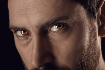Captivating gaze. Man with rare eye color, closeup