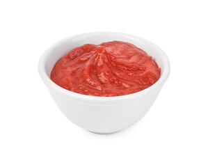 Organic ketchup in bowl isolated on white. Tomato sauce