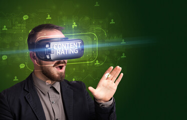 Businessman looking through Virtual Reality glasses, social media concept