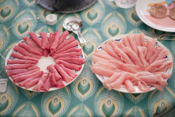 Raw meat fondue in the plate 