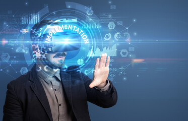 Businessman looking through VR glasses