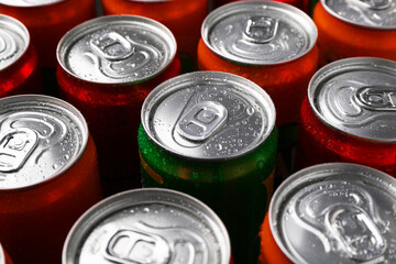 Energy drink in wet cans, closeup. Functional beverage