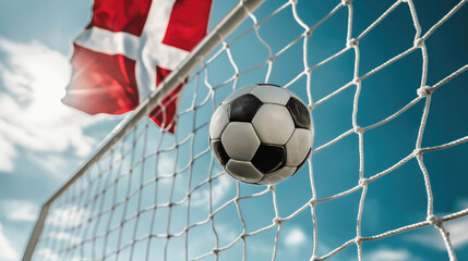 Soccer ball and Denmark flag on the background of the football goal. Concept of 2024 UEFA European Football Championship