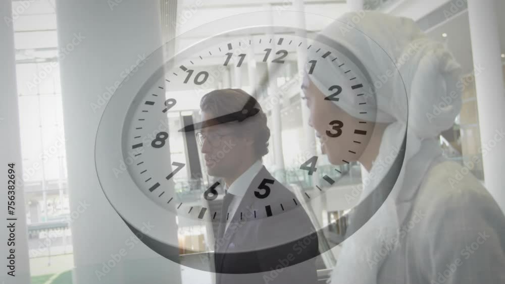 Aufkleber animation of moving clock over diverse colleagues walking and discussing work in office