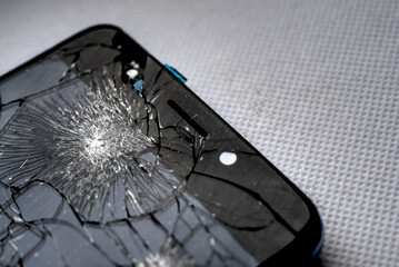Fragment of smartphone with broken screen