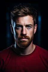 Obraz premium Portrait of a serious man with red beard and blue eyes