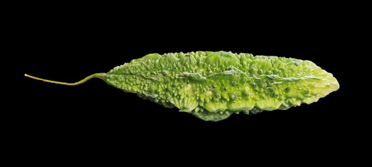 bitter gourd on black background