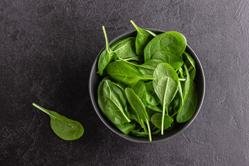 Fresh green spinach leaves in the bowl. Natural vegetarian food.