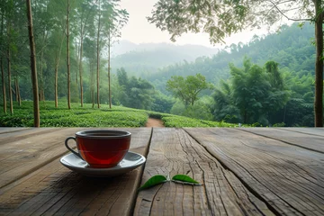 Plexiglas foto achterwand cup of tea on a wooden table © Arham