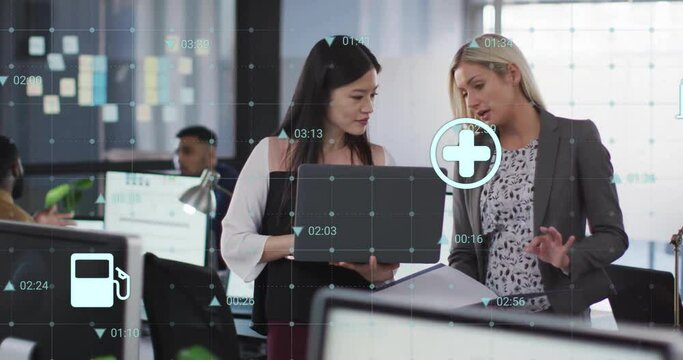 Animation of data processing over diverse female colleagues discussing work in office