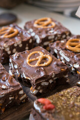 Decorated chocolate cake sliced on a tray.