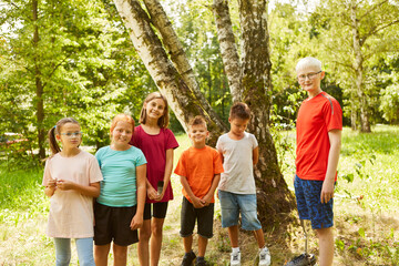 Group of children with handicapped boy in nature as inclusion concept