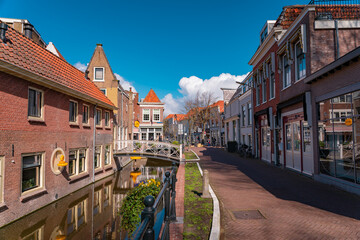 Fototapeta premium Gouda, The Netherlands, March 28 2023; Shopping street in the picturesque town of Gouda the cheese capital of the world