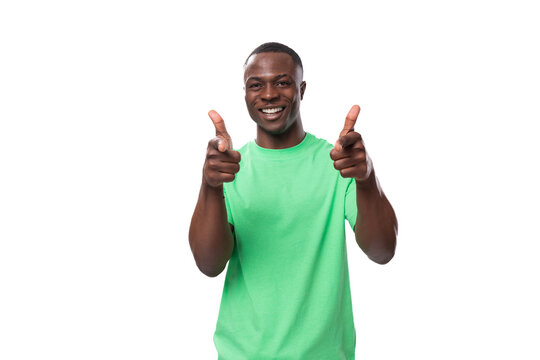 Young Lucky 30 Year Old American Guy Dressed Casually In A Basic T-shirt And Jeans