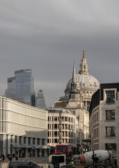 Naklejka premium A view along Fleet Street and Ludgate Hill towards the dome of St Paul s Cathedral at distance. Street City of London, Space for text, Selective focus.