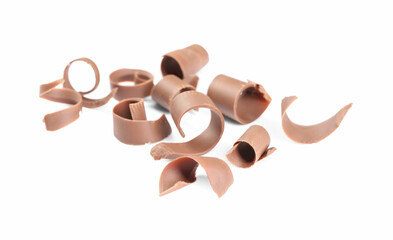 Many delicious chocolate shavings isolated on white