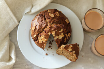 Chocolate cake on a white plate and coffee