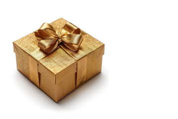 Gift box in gold craft wrapping paper and gold satin ribbon on white background.
