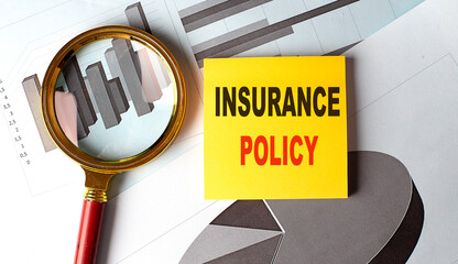 INSURANCE POLICY text on sticky on chart, business