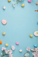 Festive Easter holiday background with decorations eggd and cookies