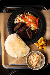 Overhead view of pita bread with meat and salad wrap food