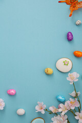 Festive blue Easter holiday background with decorations eggd and cookies - 756426645