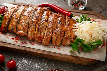 Close up of grilled ribs on wooden platter food