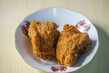 crispy fried chicken in a white plate