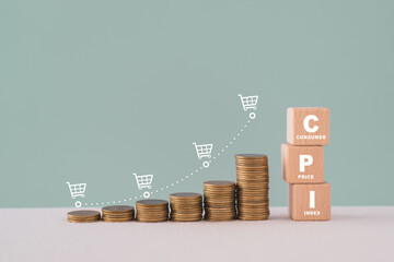 CPI, consumer price index concept. Wooden block with CPI word and stack of coins and increasing...