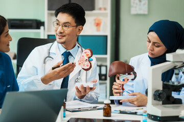 Obraz premium A diverse group of healthcare professionals, including doctors, nurses, and specialists, engaging in a collaborative meeting to discuss medical cases and share expertise in a hospital