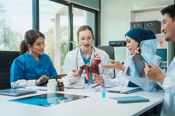 A diverse group of healthcare professionals, including doctors, nurses, and specialists, engaging in a collaborative meeting to discuss medical cases and share expertise in a hospital