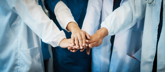 A dedicated team of doctors and healthcare professionals working collaboratively in a hospital...