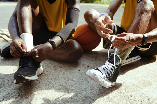 Black men wearing sports shoes for playing streetball