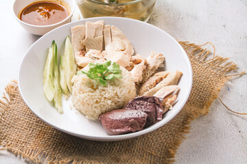 Hainanese chicken rice or rice steamed with chicken soup - Asian food style