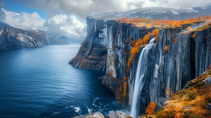 Majestic Autumn Waterfalls Cascading into Tranquil Mountain Lake Surrounded by Colorful Foliage