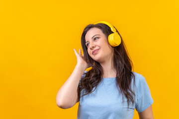 Cute woman listening to music with wireless headphones