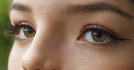 Girl with false eyelashes close up.